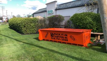 dump trailer in the grass